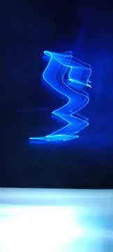Simulation of galaxy light motion of stars in dark background, future energy 스톡 사진