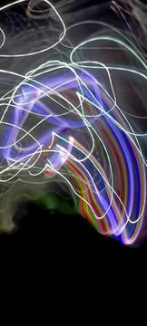Simulation of galaxy light motion of stars in dark background, future energy 写真素材