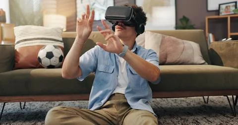 Simulation, gamer and man with vr headset, home and 3D virtual reality with tech Stock Photos