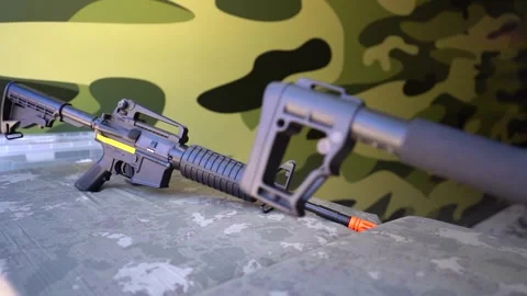 Simulation of Military Games with Plastic Weapons Stock Footage 248828337