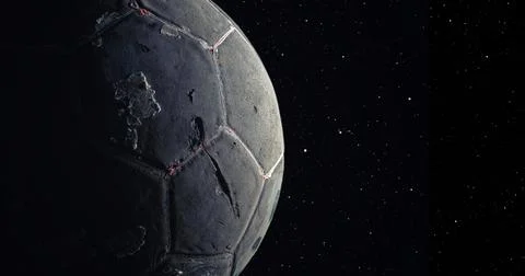 Simulation of the Moon's surface with a used soccer ball. Concept of space-ti Stock Photos