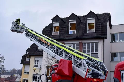 Simulation process of rescue of people by firefighters with a telescopic cran Stock Photos
