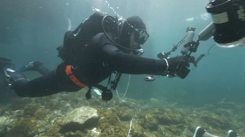 Simulation of underwater crime detection on the back of the dummy,Ustica,Med sea Stock Footage 124388884