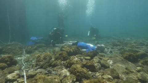 Simulation of an underwater crime with dummy,Ustica, Mediterranean sea  Stock Footage 124343473
