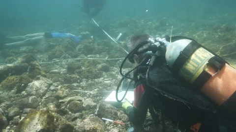 Simulation of underwater crime scene divers making detections with dummy, Ustica Stock Footage 124271158