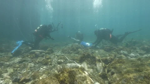 SImulation underwater divers turn dummy upside down, Ustica. Mediterranean sea Stock Footage 124389017