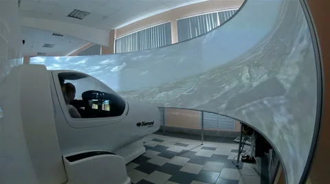 Simulator for training pilots . The cab and the big screen Stock Footage 65286701