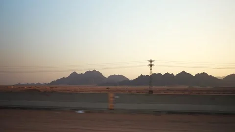 Sinai mountains in the desert at sunset. Side view from the fast moving car with Stock Footage 251744481