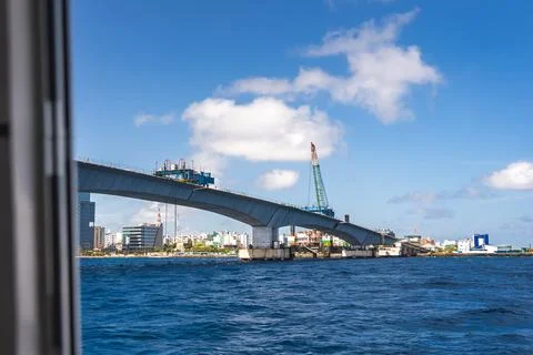 Sinamale Bridge under construction across sea in Male Maldives Stock Photos