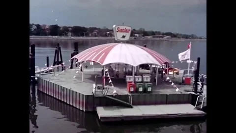 Sinclair created a floating service station at the marina at the New York Worlds Stock Footage