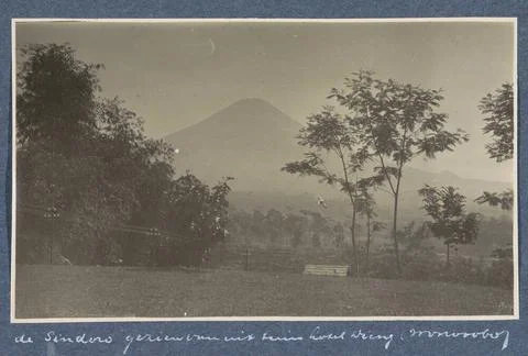 Sindoro volcano on Java seen from the front garden of Hotel Dieng in Wonos... Stock Photos