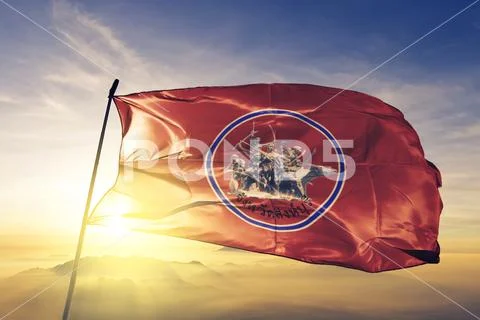 Sing Buri province of Thailand flag waving on the top sunrise mist fog Stock Photos