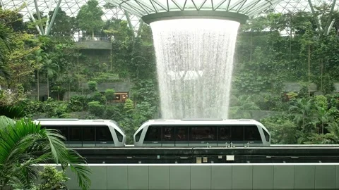 Singapore 26.07.2026 Rain Vortex Waterfall and MRT Train at Jewel Changi Airport Stockbeeldmateriaal 342249155