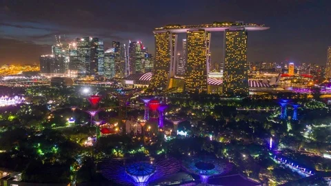 Singapore Aerial night Marina bay sands Super trees Stock Footage