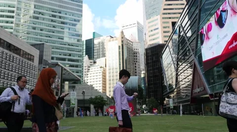 Singapore central business district at Raffles place morning crowd Stock Footage