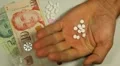 Singapore Dollar SGD, Counting Drugs and Money, Health Care, Colorful Pills HD Footage