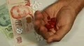 Singapore Dollar SGD, Counting Drugs and Money, Health Care, Colorful Pills HD Footage