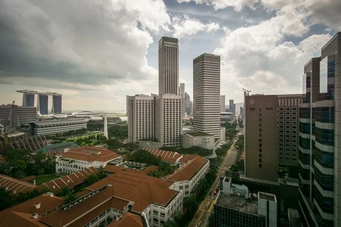 Singapore high angle timelapse clouds city centre raffles hotel marina bay Stock Footage 111766290