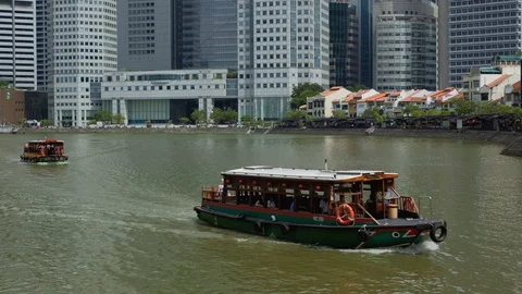 Singapore - May 2018: River view with boats and contrast of financial district s Stock Footage 90959042