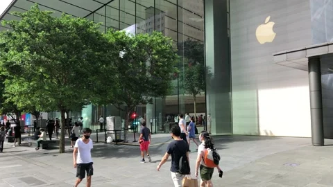 Singapore: People pass by the first Apple Store on Orchard Road, 4K Stock Footage 165063530