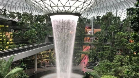 Singapore: Rain vortex indoor waterfall at Jewel terminal Changi Airport, 4K Stock Footage 165227551
