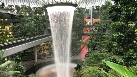 Singapore: Rain vortex indoor waterfall at Jewel terminal Changi Airport, 4K Stock Footage 165227563