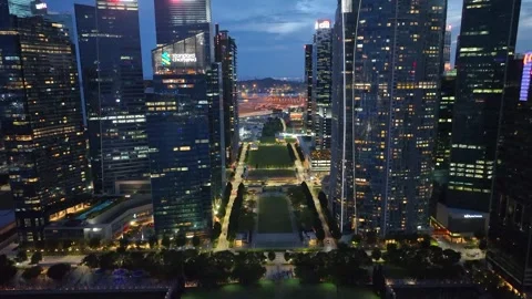 Singapore skyline. Flight over the wall of skyscrapers in night lights Stock Footage 303552143