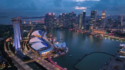 Singapore skyline. Flight over the wall of skyscrapers in night lights Stock Footage 314342248