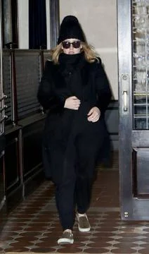  Singer Adele greets fans as she leaves a downtown hotel on November 18 20... Stock-Fotos