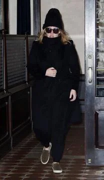  Singer Adele greets fans as she leaves a downtown hotel on November 18 20... Stock-Fotos
