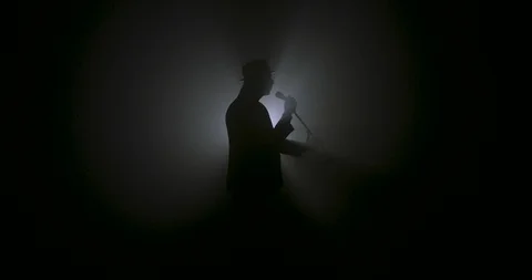 Singer with a microphone silhouette 動画素材 103653614