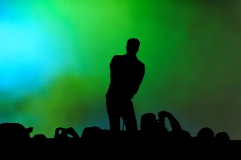 Singer performing to crowds Stock Illustration