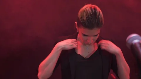 Singer prepare to step in to the microphone and start the show on stage Stock Footage 100712670