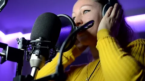 Singer recording song in professional studio Stock Footage 300498908
