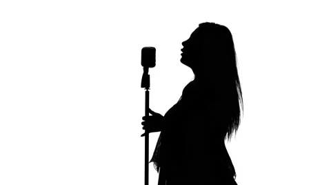 Singer with retro microphone. White. Silhouette Stock Footage 64276161