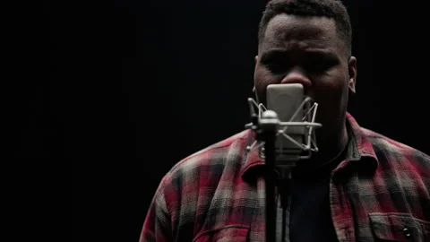 Singer Sings In A Close-up Shot Stock Footage 236512666