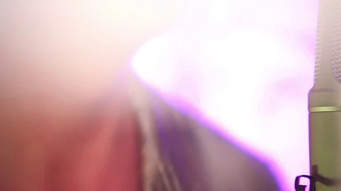 The singer sings into the microphone Stock Footage 74421133