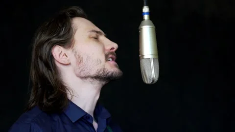 A singer sings in a recording Studio 動画素材 130930618