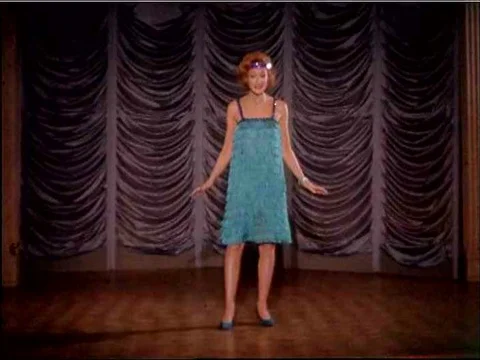 Singers and dancers perform, including a flapper and a guitarist, in 1962. 스톡 동영상 74976548