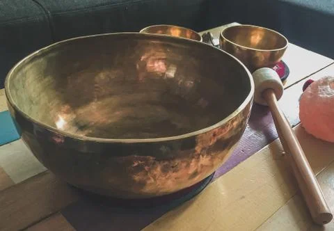 Singing bowls on a table Stock Photos