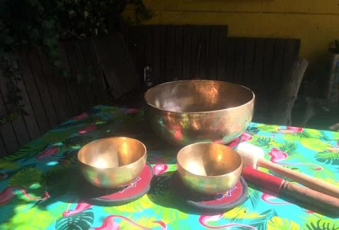 Singing bowls on a table Stock Photos