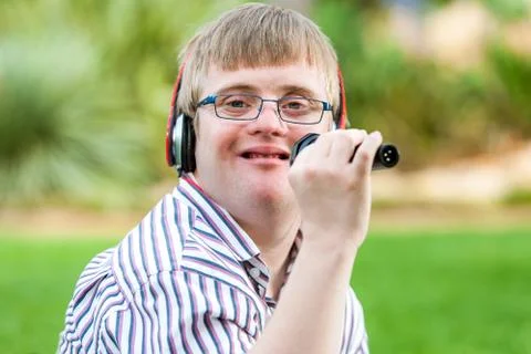 Singing handicapped boy. Stock Photos