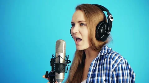 Singing with headphones Stock Footage 21502387