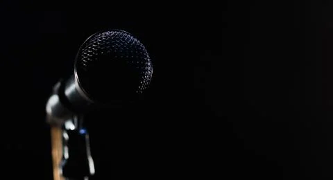 Singing mic on a black background with space for text Stock Photos