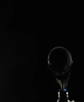 Singing mic on a black background with space for text Stock Photos