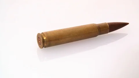 Single .50 Bmg Machine Gun  bullet shell rotating on white background. Stock Footage 117542837