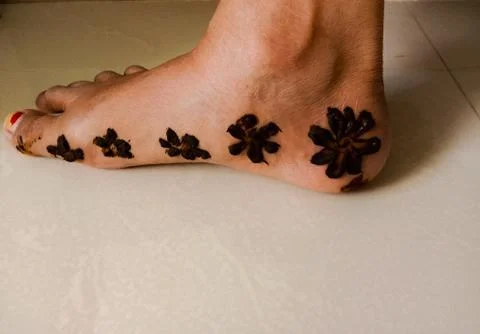 Single and simple henna design feet Stock Photos