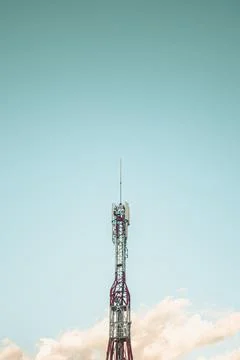 Single antenna with the bright blue sky as the background Stock Photos