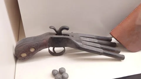 Single Antique Flintlock Pistol on Display Stock Footage 334136359