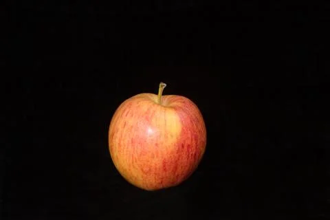 Single Apple on black Stock Photos